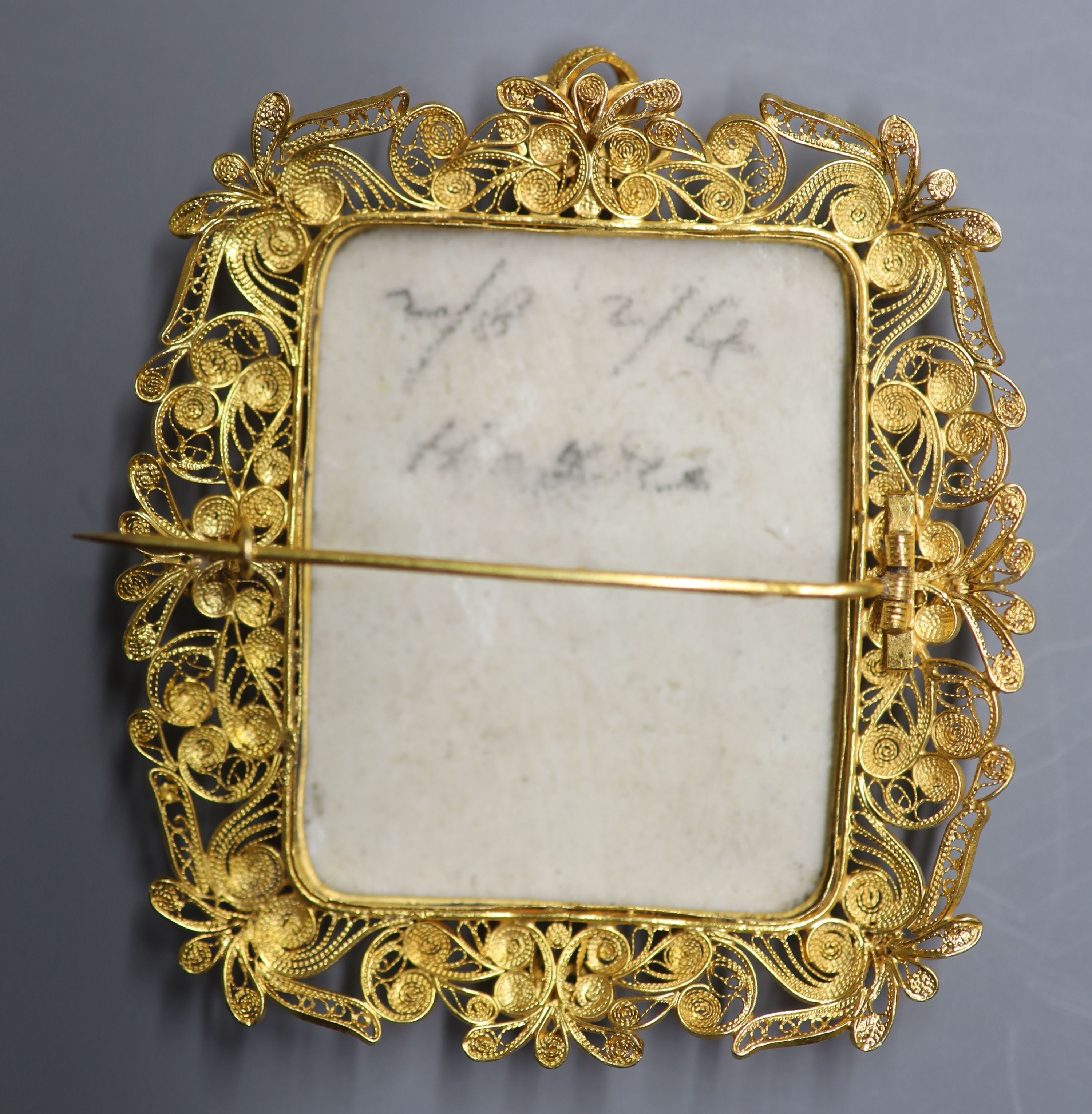 A 20th century filligree yellow metal mounted porcelain plaque pendant brooch, decorated with Madonna & Child, 60mm,